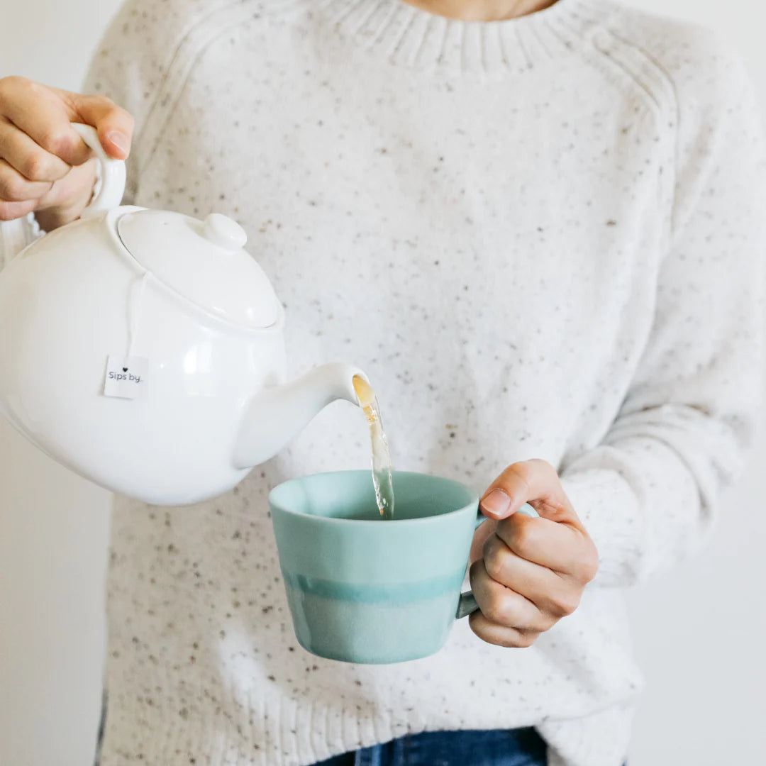 woman pouring tea