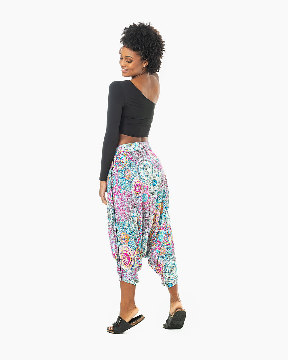 Full-length view of purple galactic monk pants on female model #color_purple Galactic