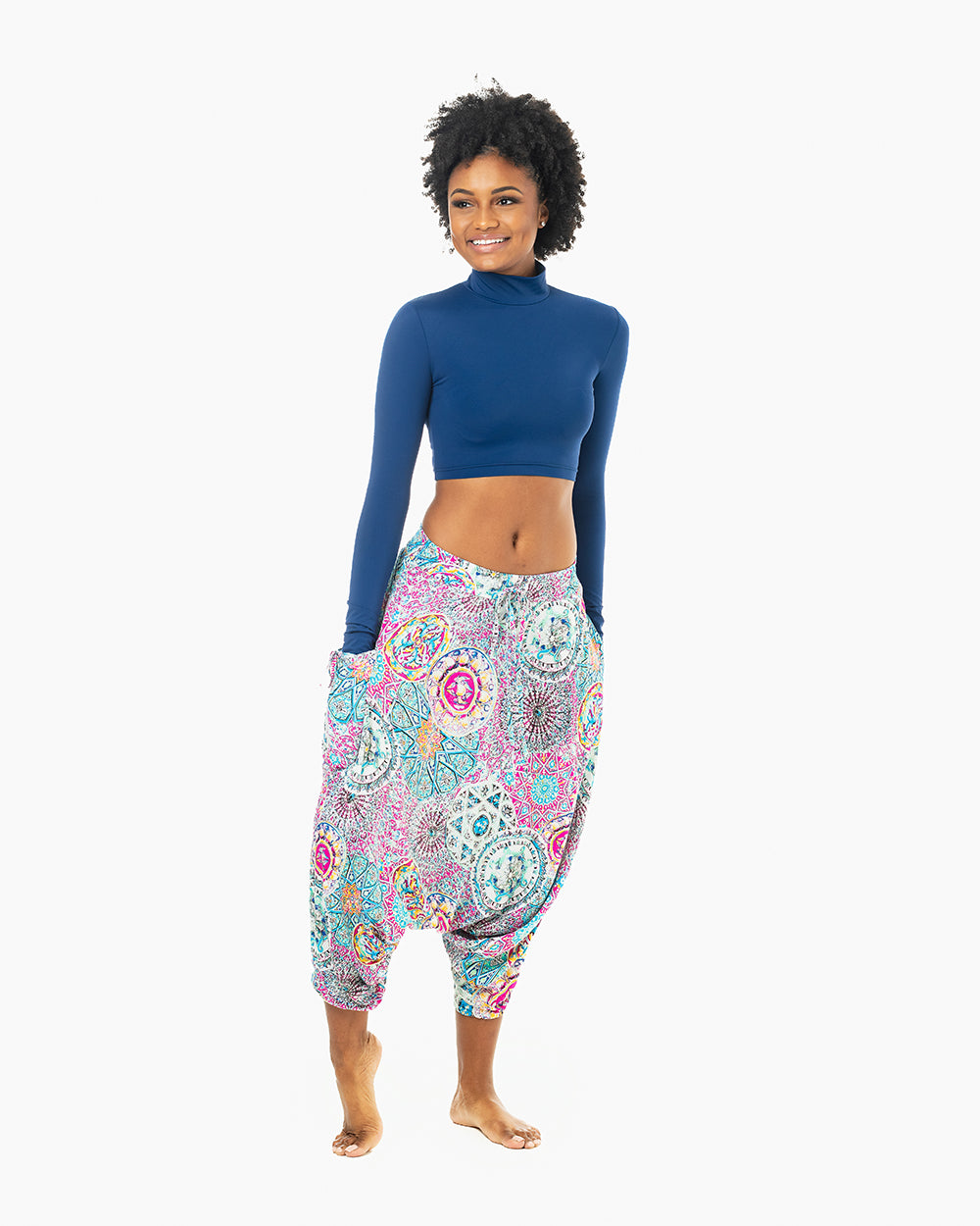 Woman happy in purple galactic MC Hammer pants outdoors #color_purple galactic