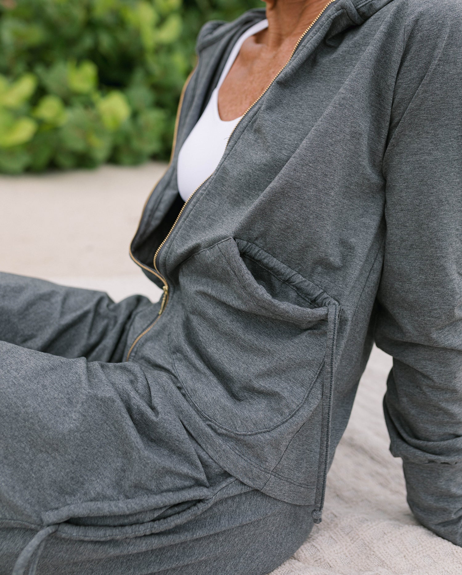Trendy woman wearing organic hoodie with harem pants #color_grey