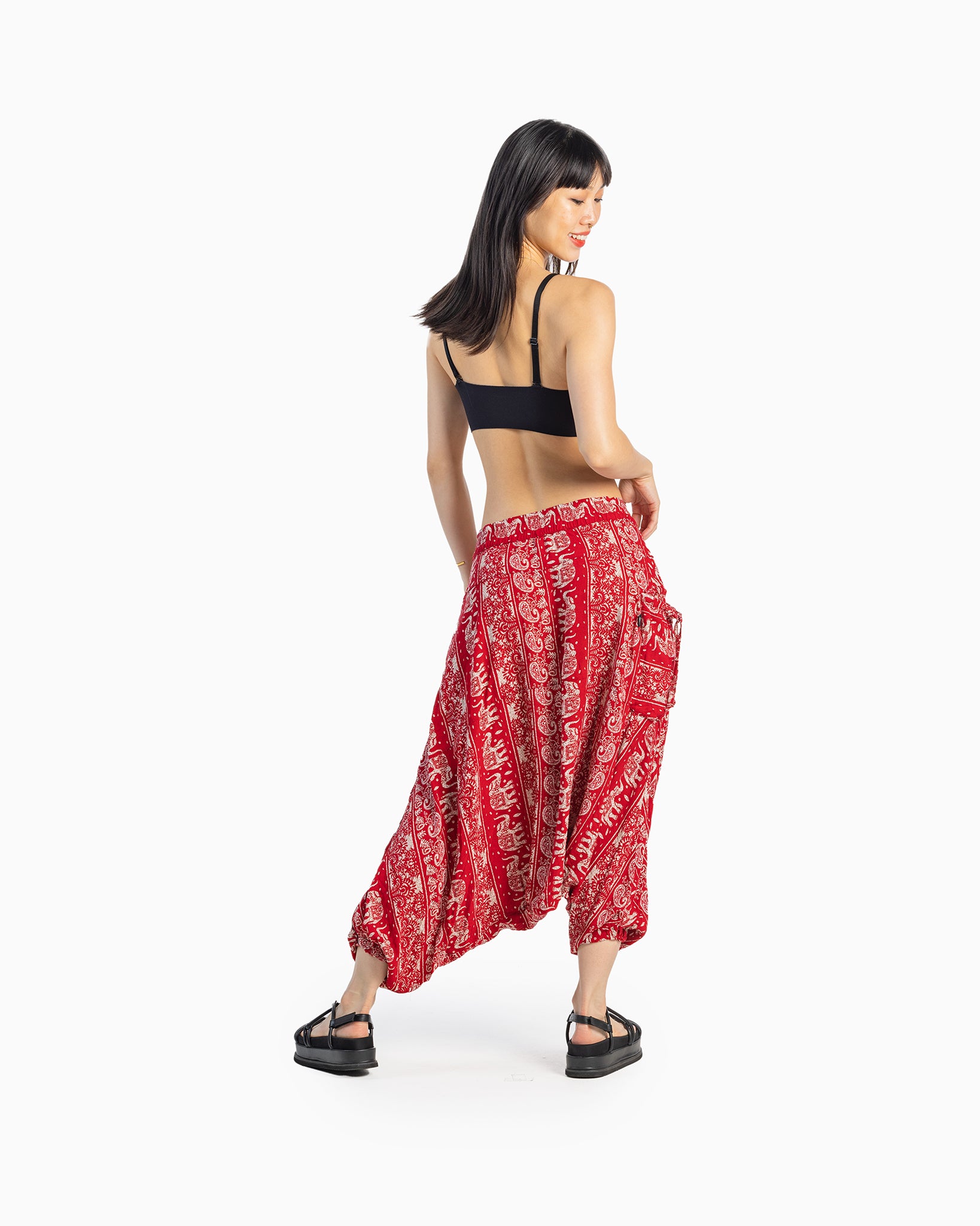 asian model wearing red lotus boho pants #color_red lotus