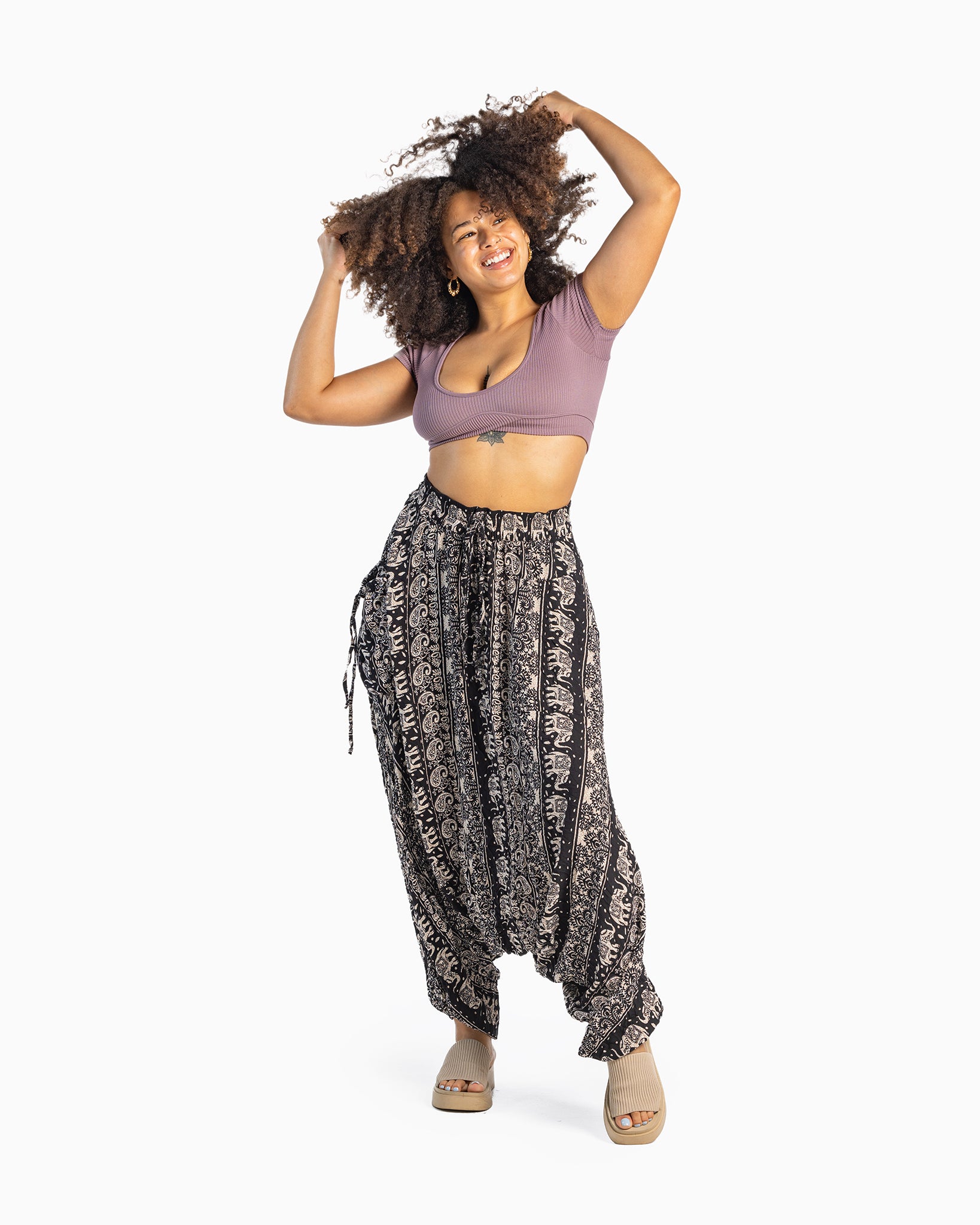 black model wearing comfy black harem pants #color_black lotus