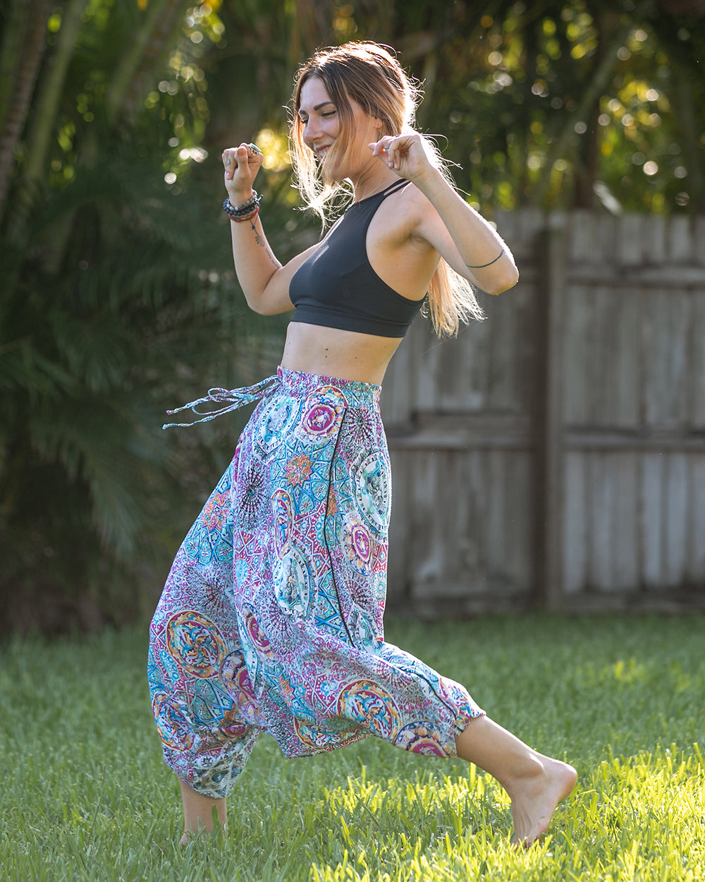 woman dancing in purple print pants #color_purple galactic