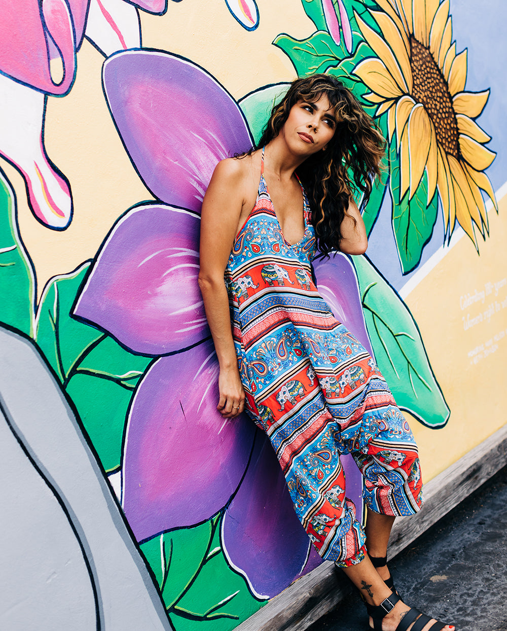 model posing with elephant print jumpsuit #color_red elephant