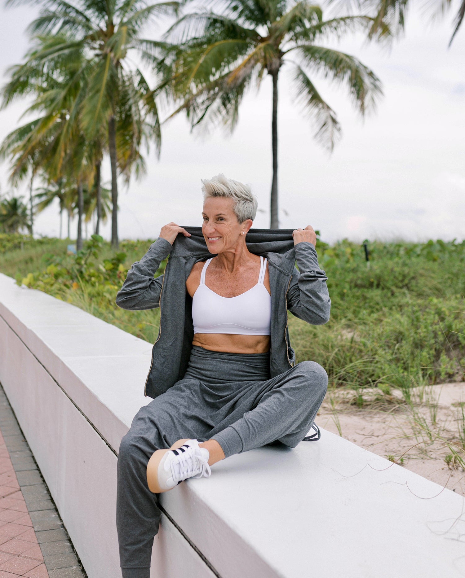 Relaxed organic hoodie with wide parachute pants for women #color_grey