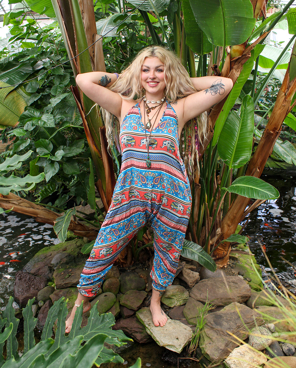 Nature setting featuring red elephant print jumpsuit #color_red elephant