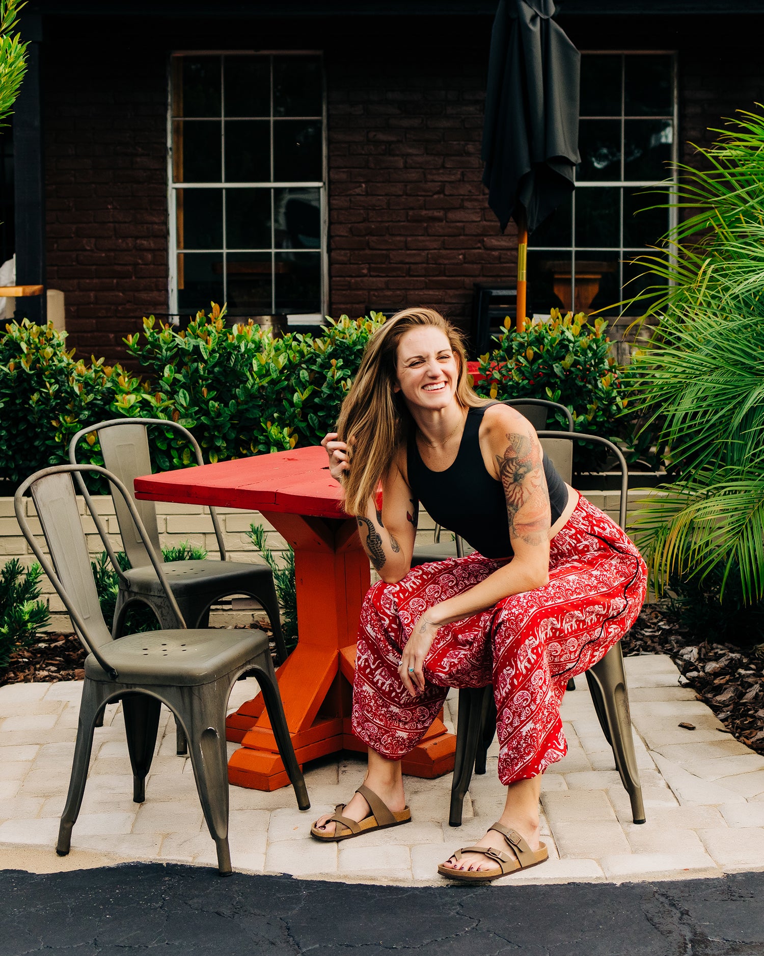 Red lotus elephant harem pants worn while having a nice time #color_red lotus