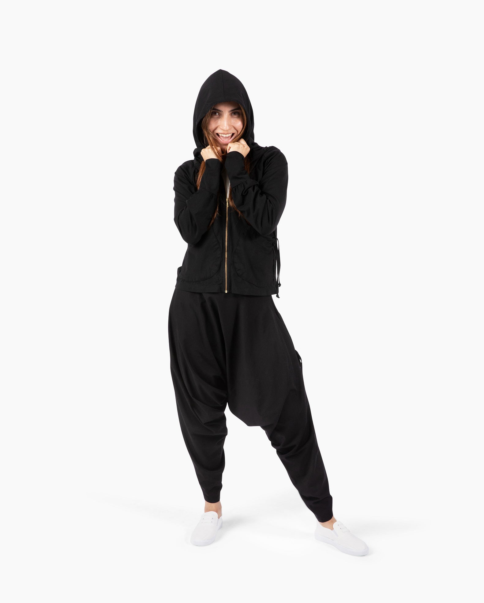 Streetwear look with parachute pants and oversized hood #color_Black