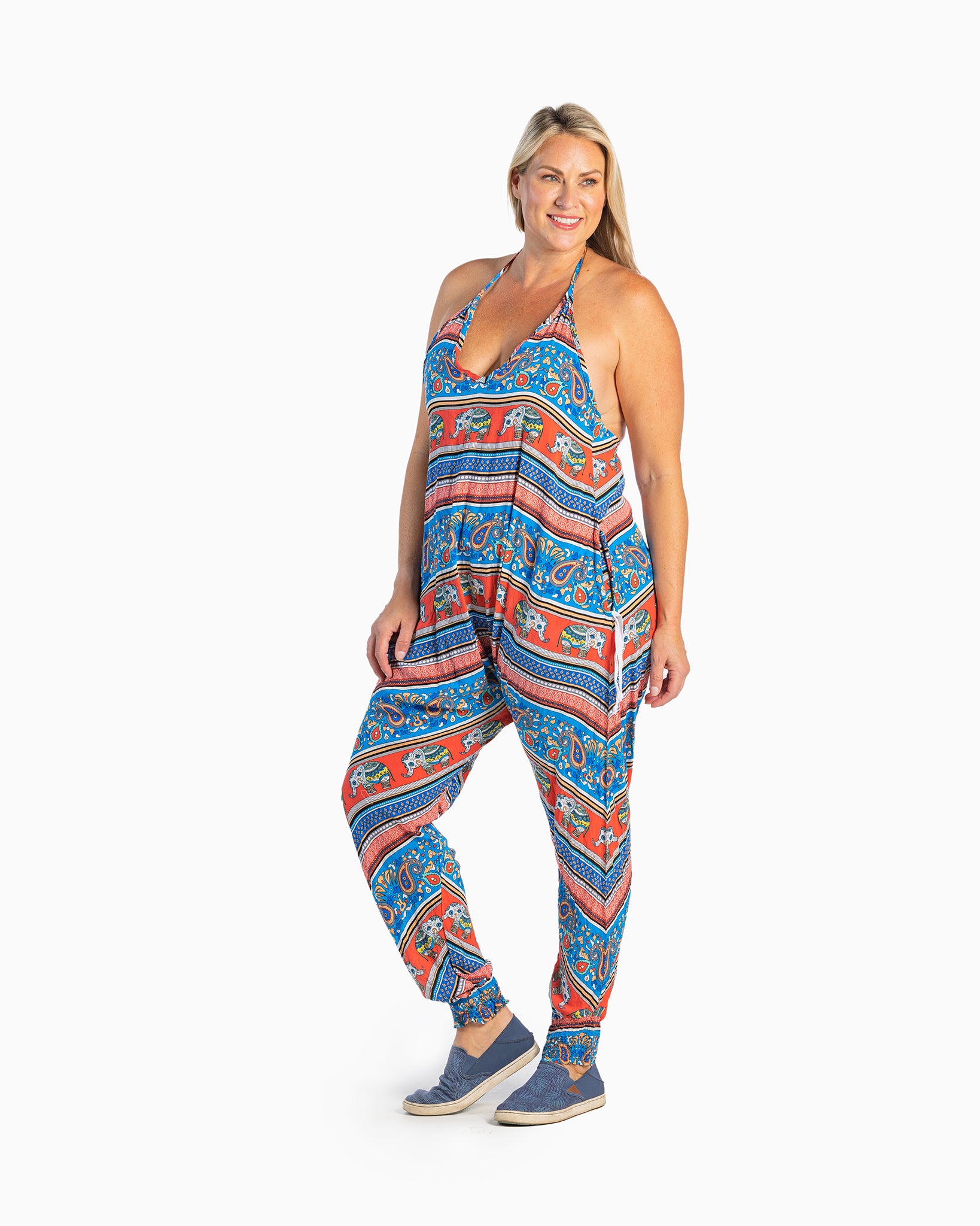 Front view of woman wearing elephant romper harem jumpsuit #color_red elephant