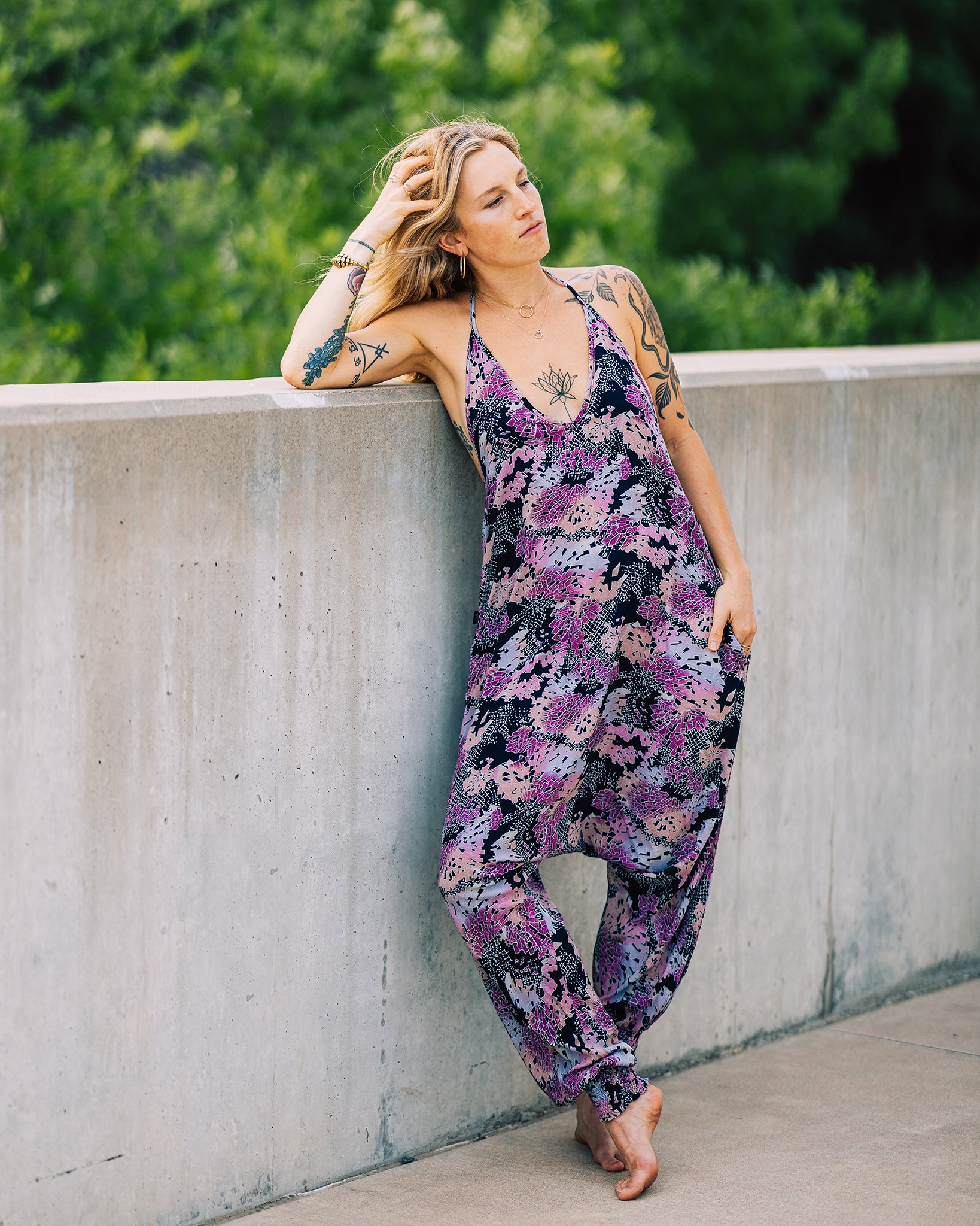 Standing woman in digital rainbow print jumpsuit #color_digital rainbow