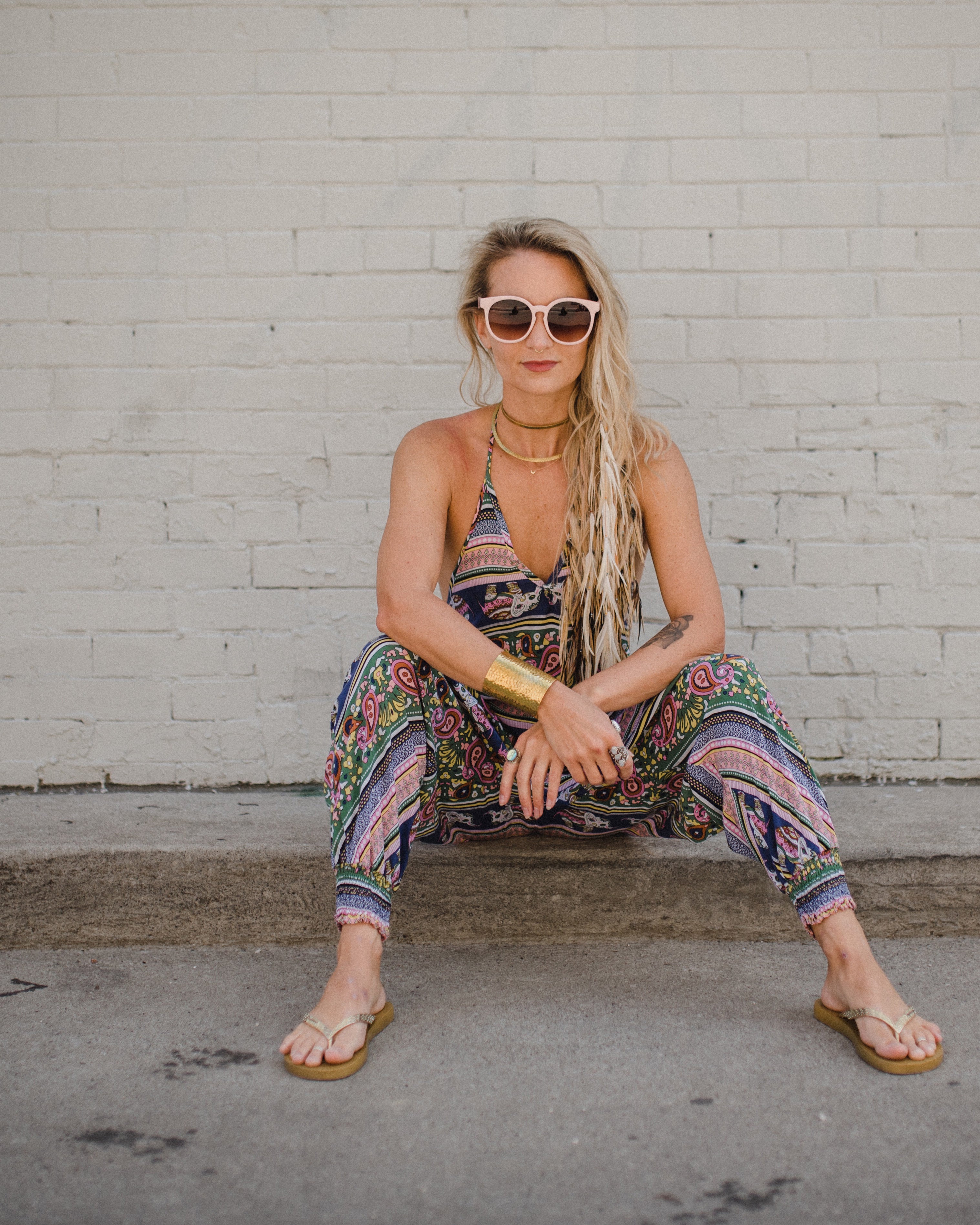 Street style of woman in red elephant print dance pants #color_pink elephant