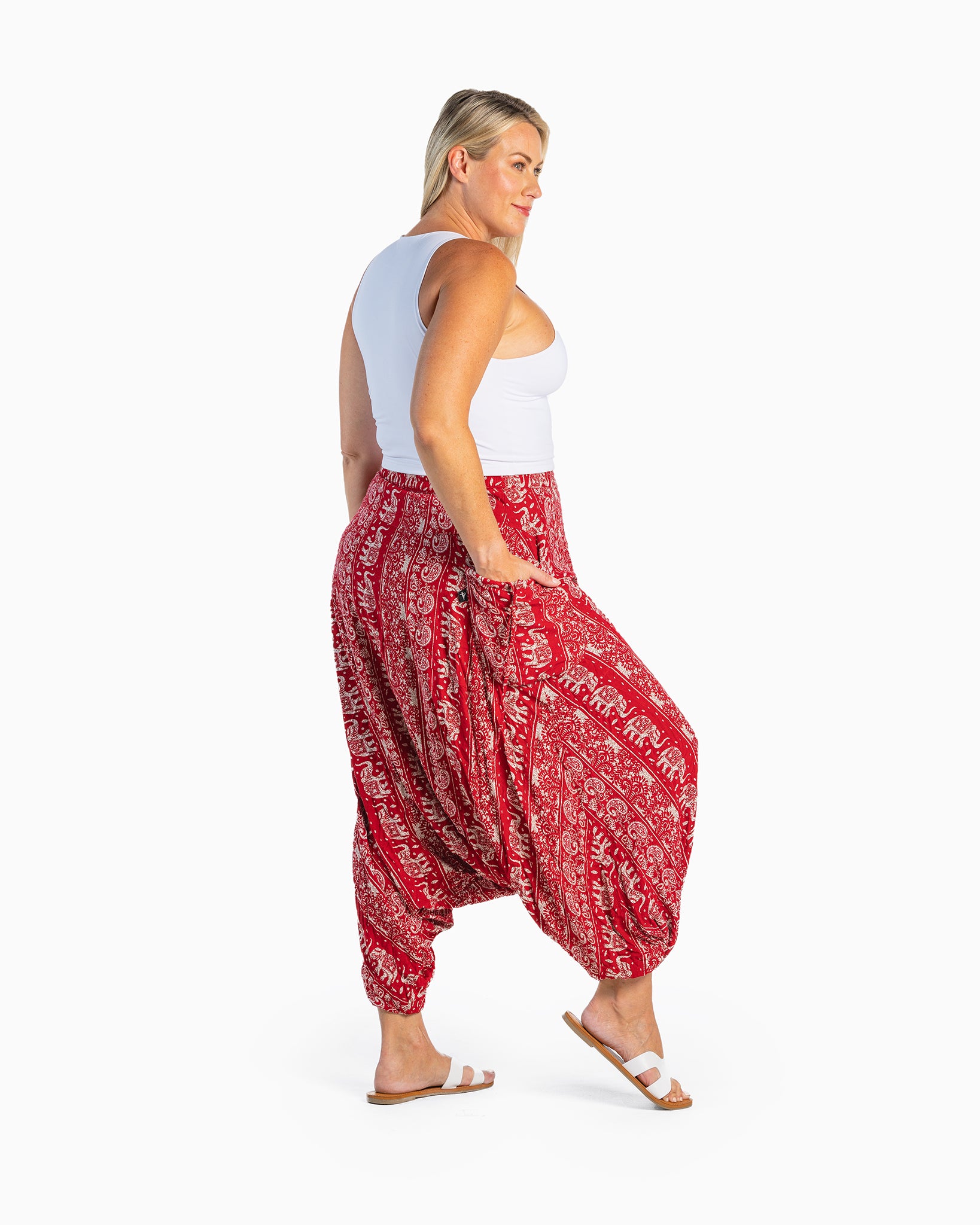 curve model wearing red boho harem pants #color_red lotus