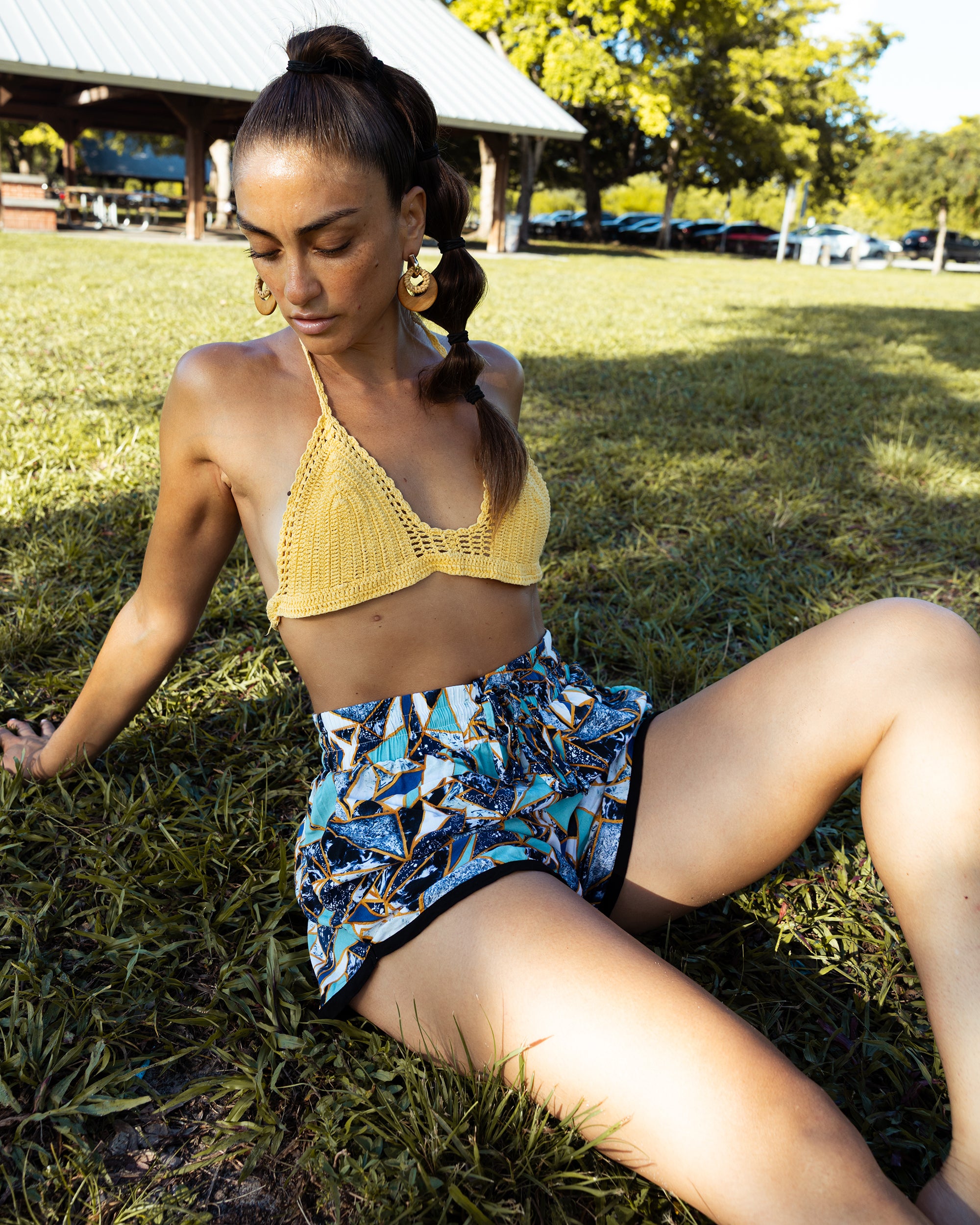yoga shorts print on grass model in roller blades in crochet top #color_jaxy