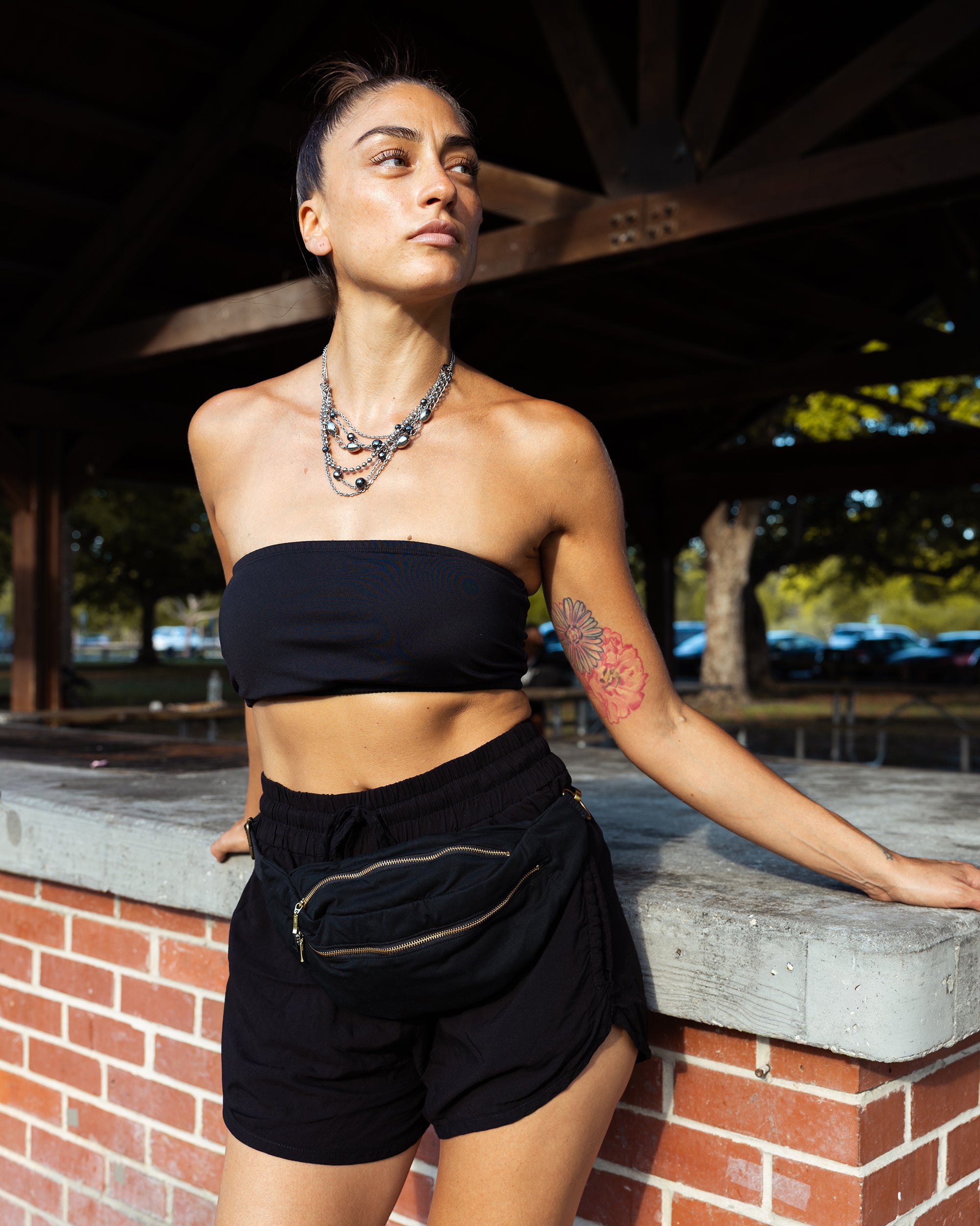 woman in yoga black harem shorts #color_black