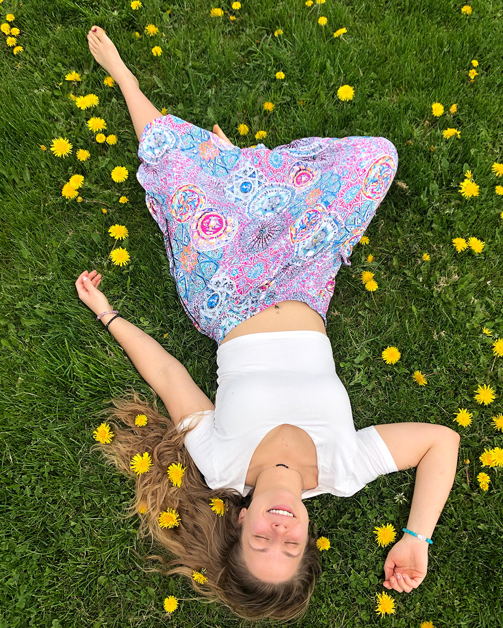 woman in purple pants laying down on grass  #color_purple galactic