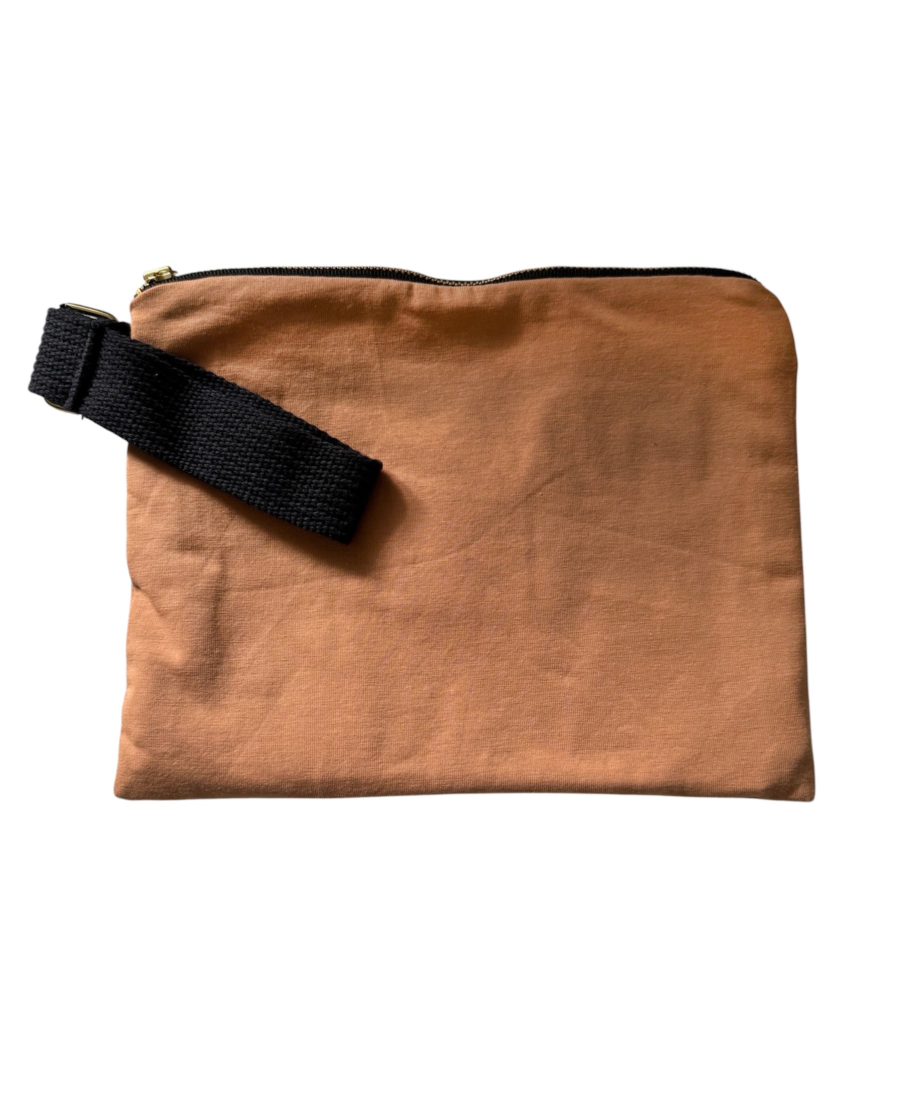 camel pouch with a black strap on a white background